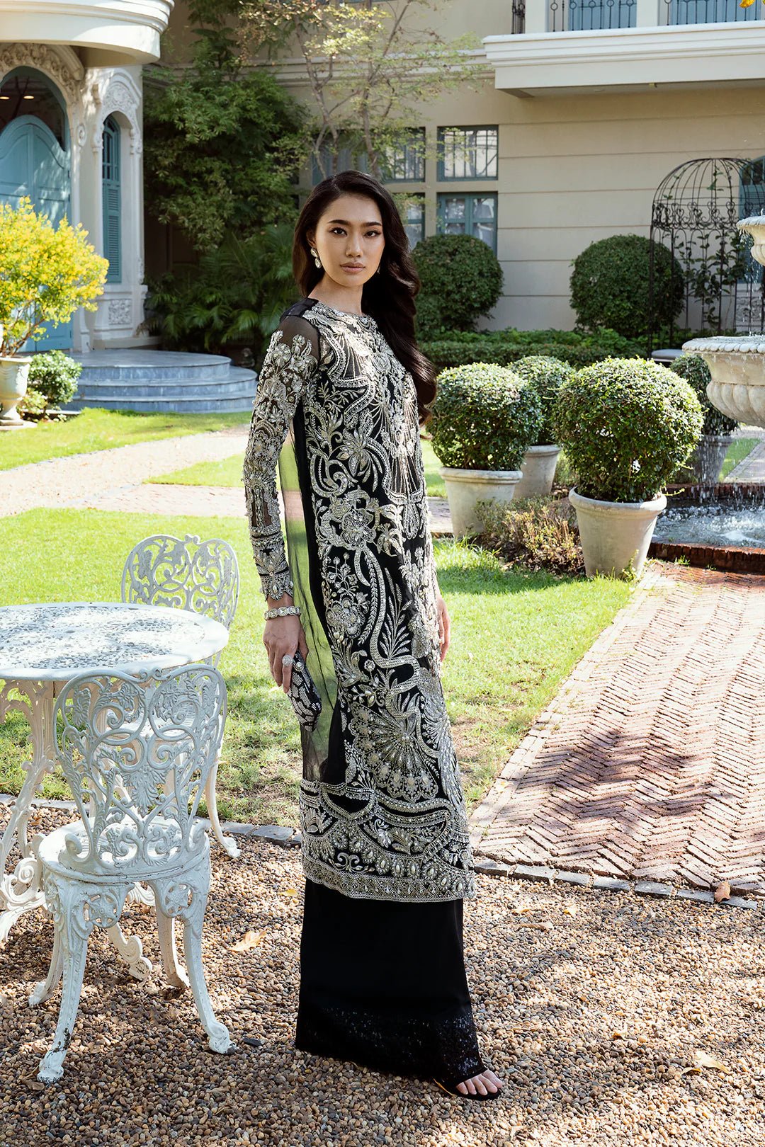 Model wearing Daisy dress from Mysie by Tahira, Eid Pret '24 collection. Pakistani clothes online in UK, floral elegance and contemporary style.