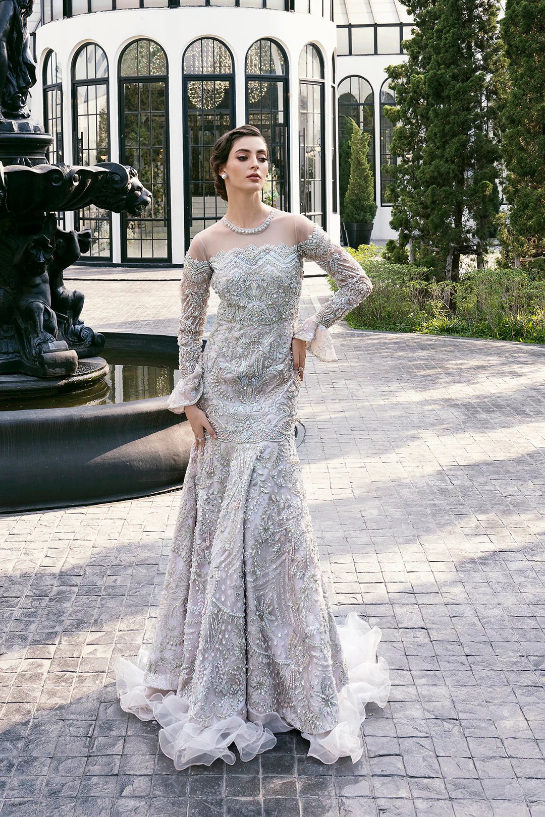 Model wearing Diana dress from Mysie by Tahira, Eid Pret '24 collection. Pakistani clothes online in UK, timeless elegance and intricate design details.