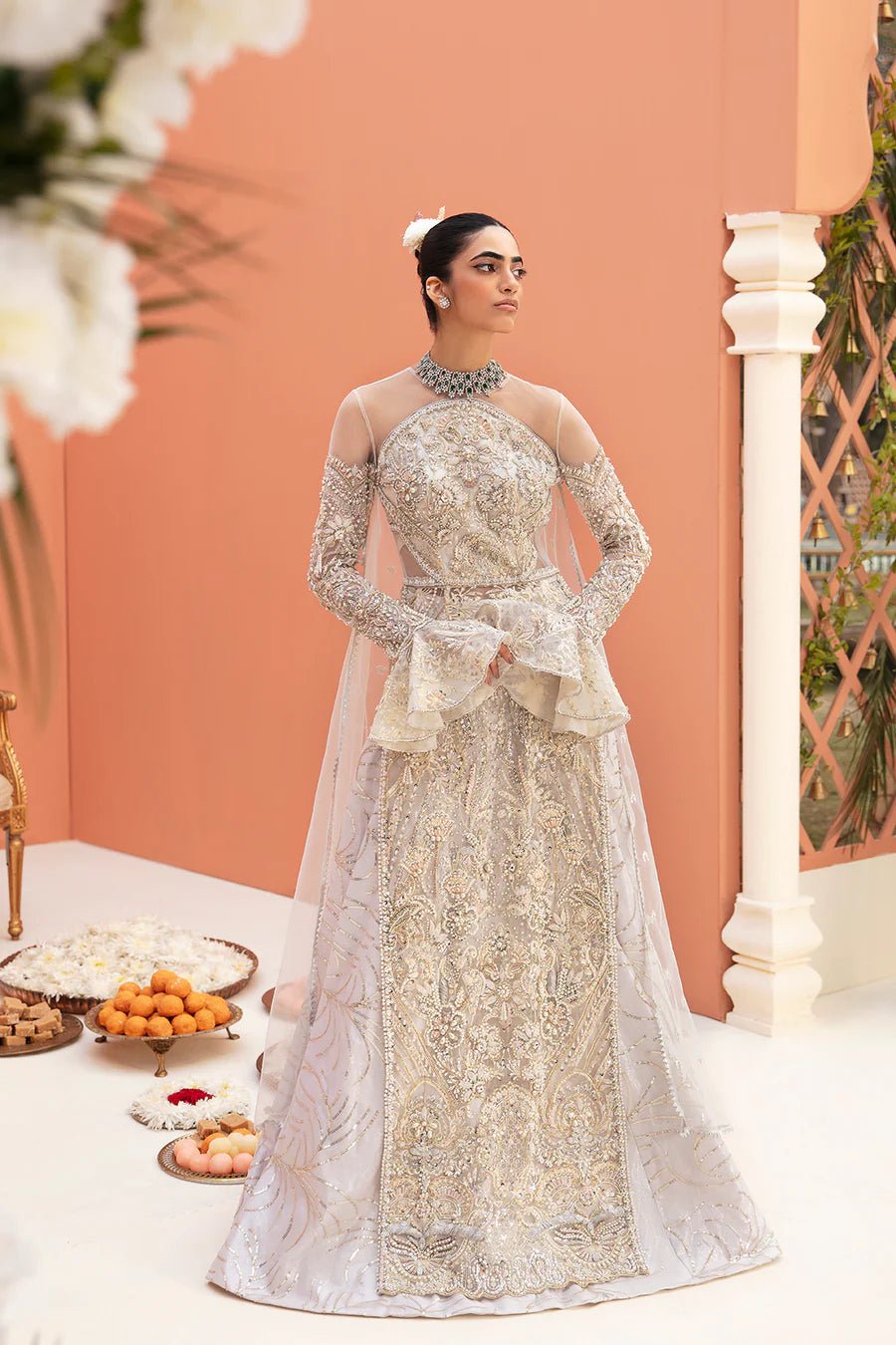 Model in a Mysie By Tahira silver Hurain gown, a pinnacle of Pakistani bridal wear in the UK.