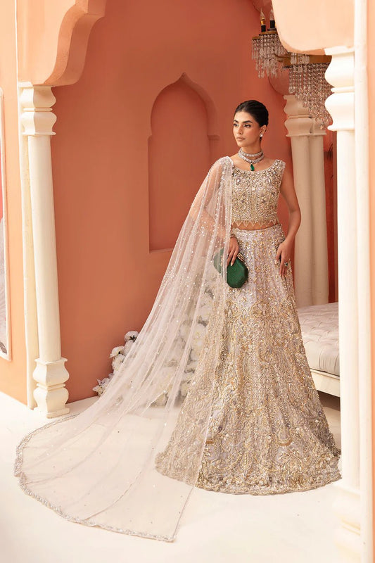 Model wearing golden Juliette bridal gown by Mysie By Tahira, epitome of luxury Pakistani clothes UK.