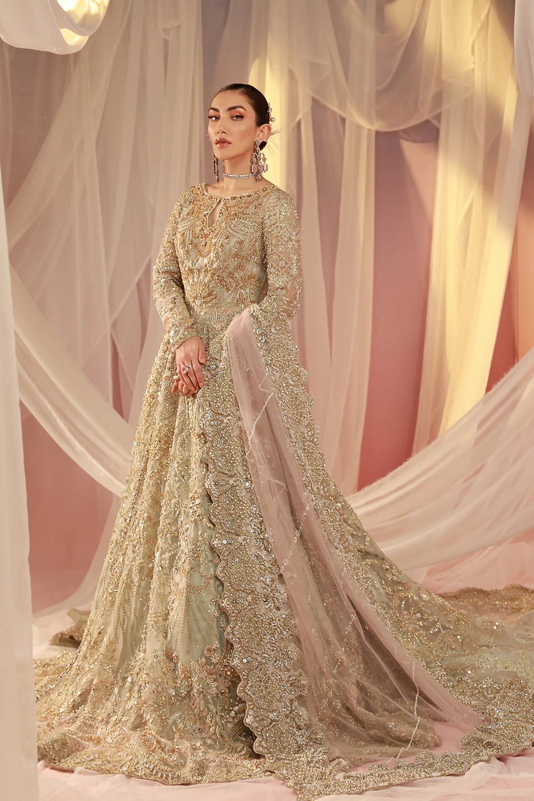 Model in a Mysie By Tahira Parisa gown, epitome of Pakistani bridal elegance in the UK.