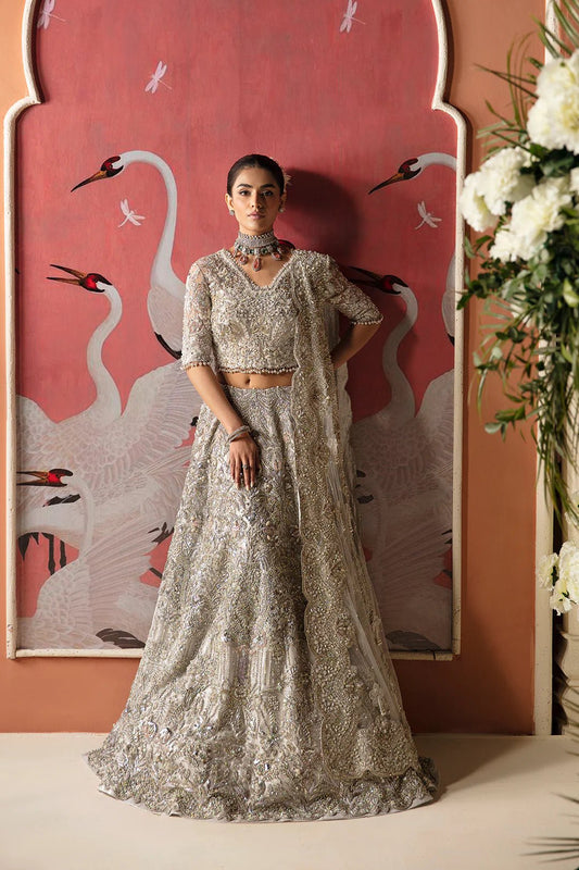 Model in a Mysie By Tahira Wajeeha gown, embodying elegance in UK's Pakistani bridal fashion.