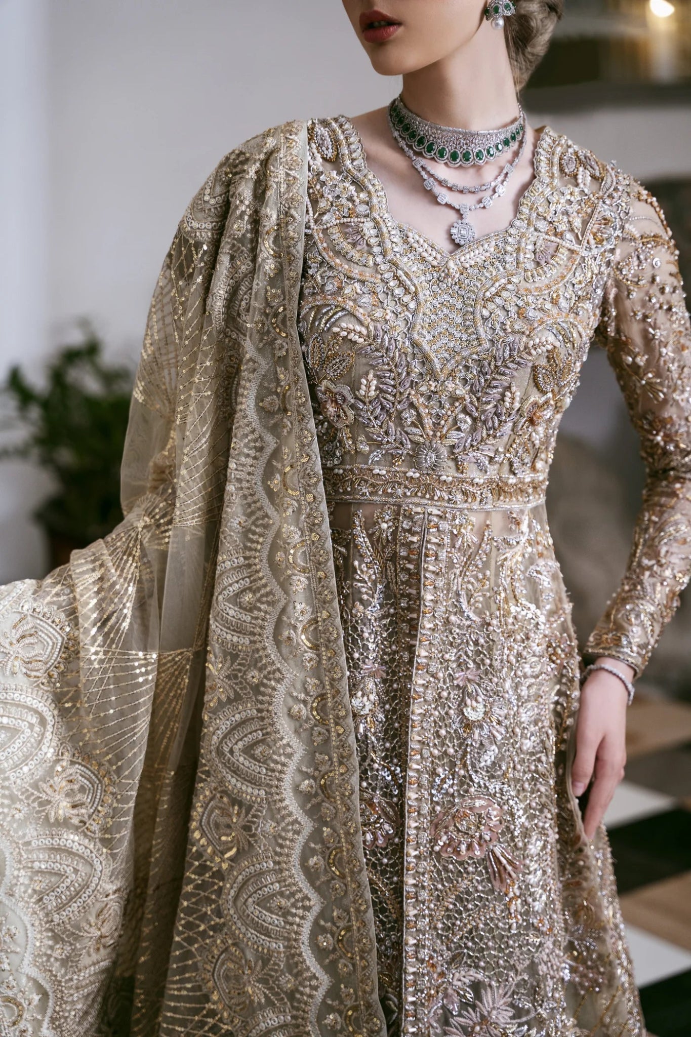 Model wearing a gold embroidered dress from Mysie by Tahira's POÉTIQUE'24 SUMMER collection, perfect for weddings. Pakistani clothes online in UK.