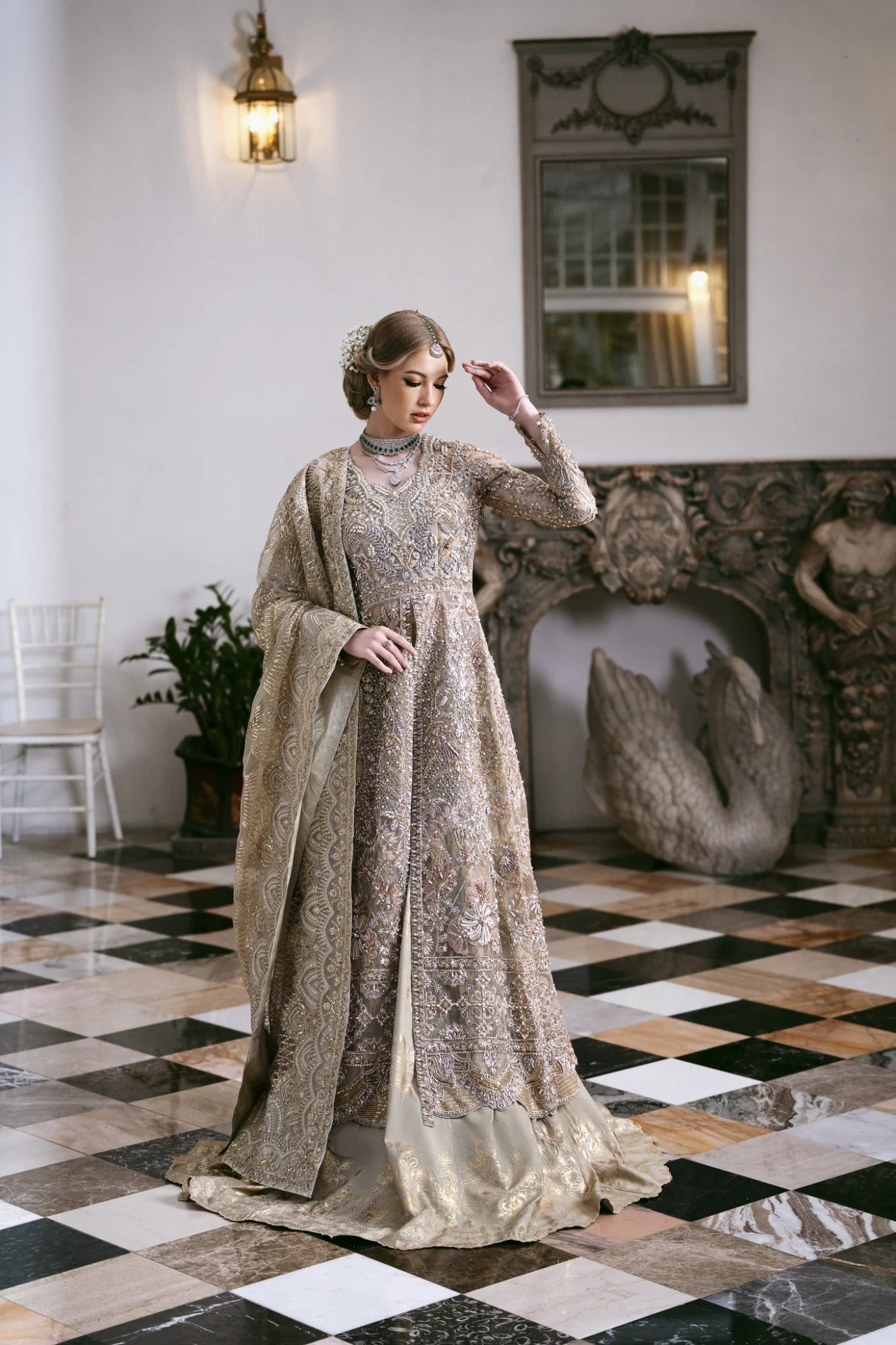 Model wearing a gold embroidered dress from Mysie by Tahira's POÉTIQUE'24 SUMMER collection, perfect for weddings. Pakistani clothes online in UK.