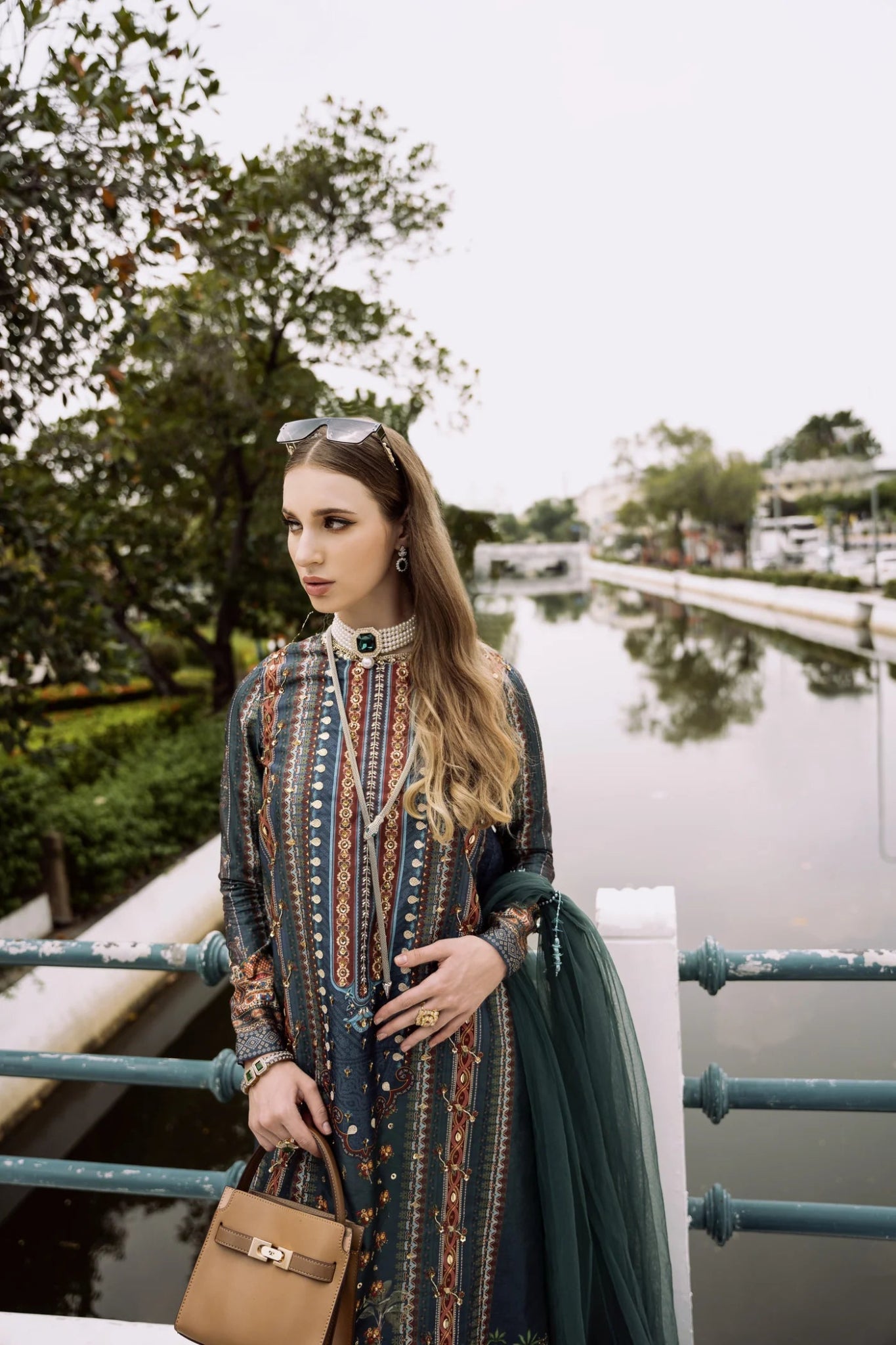 Model wearing green RISHA dress from Mysie By Tahira, part of the Zenal Summer Pret collection. Perfect for showcasing Pakistani designer clothes in the UK, including readymade clothing options.