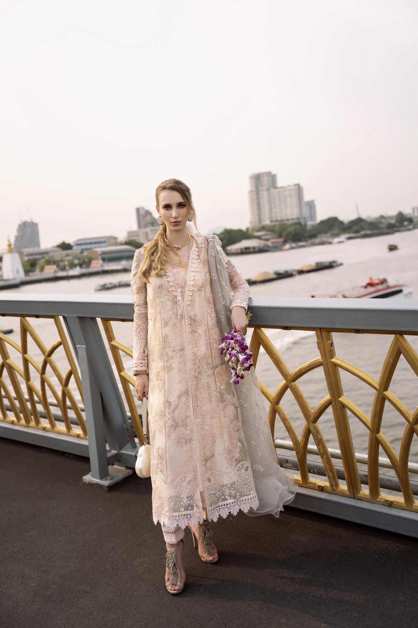 Model wearing a peach ZENEL dress from Mysie By Tahira, Zenal Summer Pret collection. Pakistani designer clothes in UK, readymade clothes.