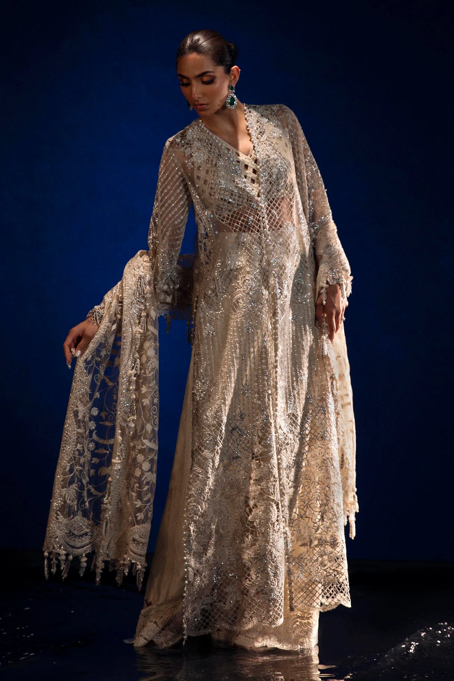 Models in Sana Safinaz N241 - 001 - 3CT attire, sparkling Pakistani dresses from UK's NURA Festive line.