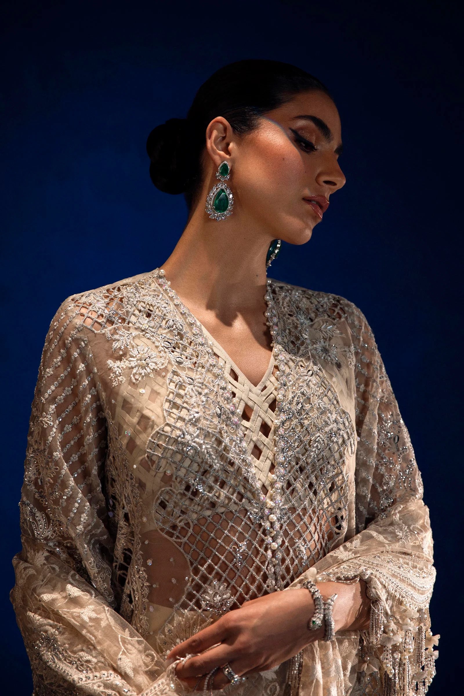 Models in Sana Safinaz N241 - 001 - 3CT attire, sparkling Pakistani dresses from UK's NURA Festive line.