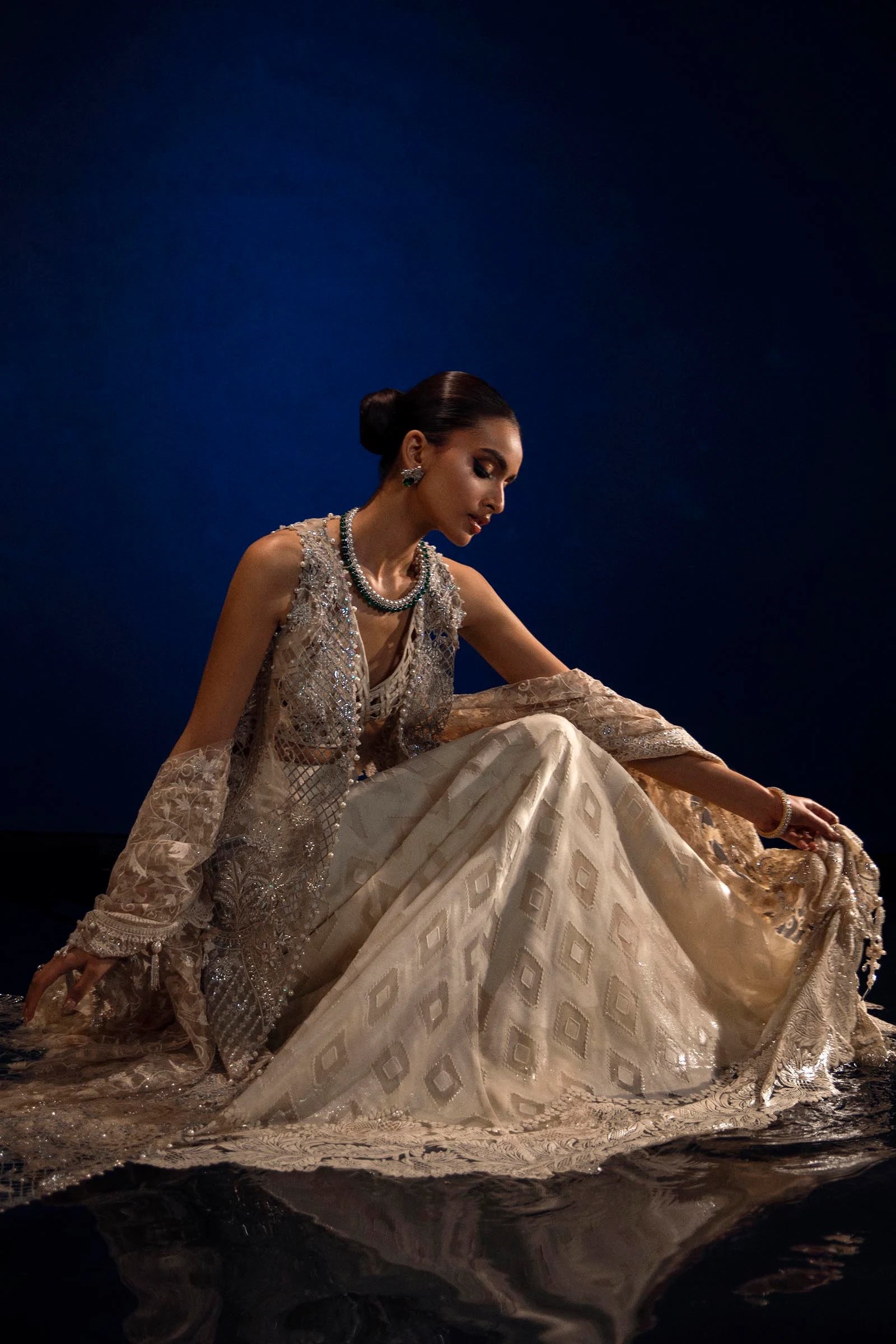 Models in Sana Safinaz N241 - 001 - 3CT attire, sparkling Pakistani dresses from UK's NURA Festive line.