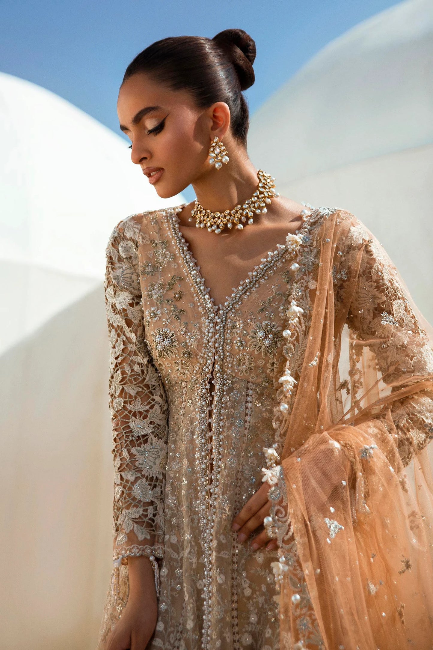 Models in glittering Sana Safinaz N241 - 002 - 3CT dresses from UK's NURA Festive Collection.