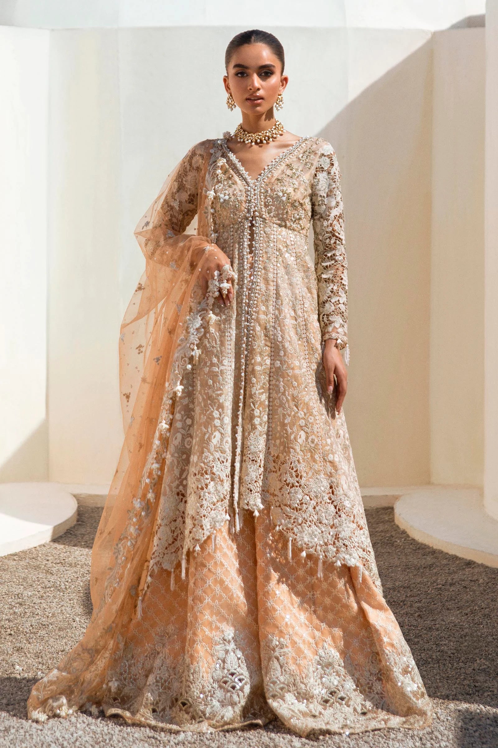 Models in glittering Sana Safinaz N241 - 002 - 3CT dresses from UK's NURA Festive Collection.