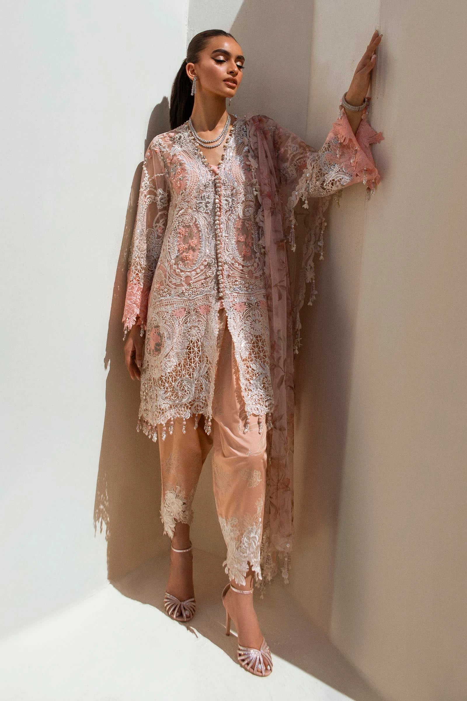 Models in peach Sana Safinaz N241 - 006 - 3CT dresses, UK Pakistani elegance.