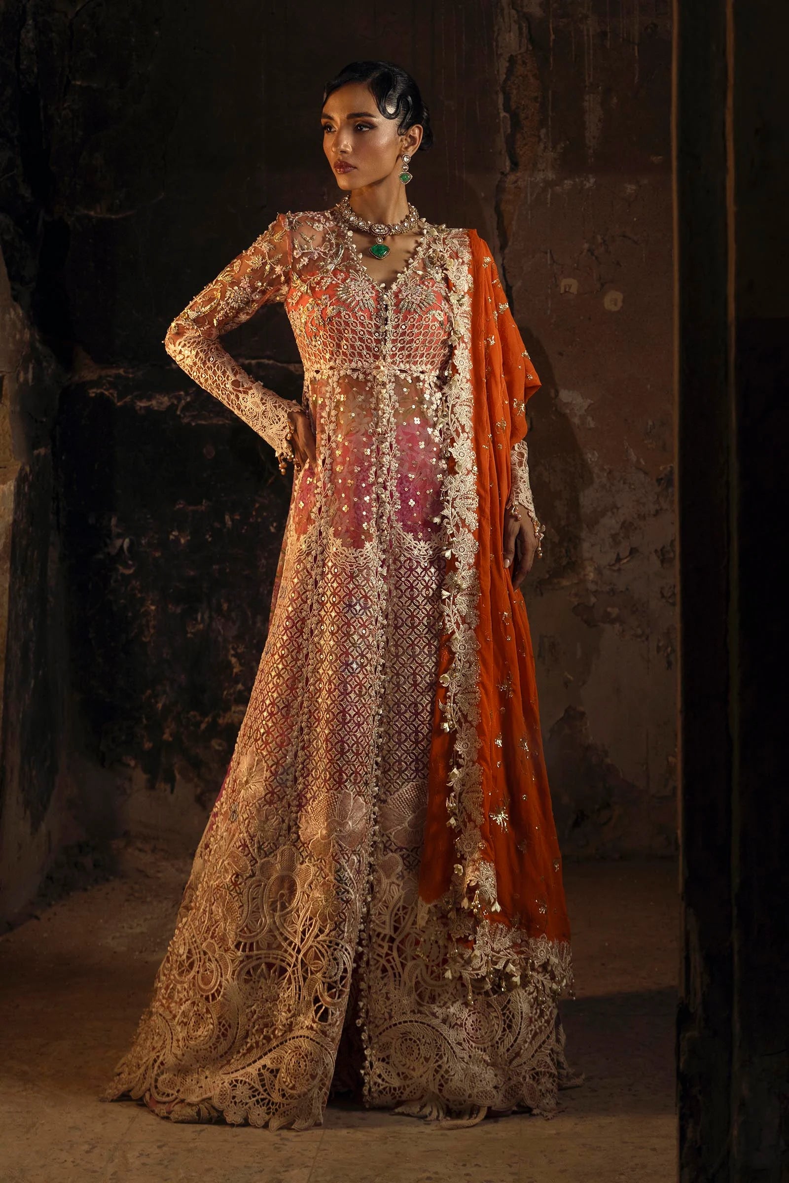 Model wearing deep coral and gold Sana Safinaz N251-002-3CX outfit with intricate embroidery and orange dupatta, Pakistani Luxury pret, Pakistani clothes online in UK.