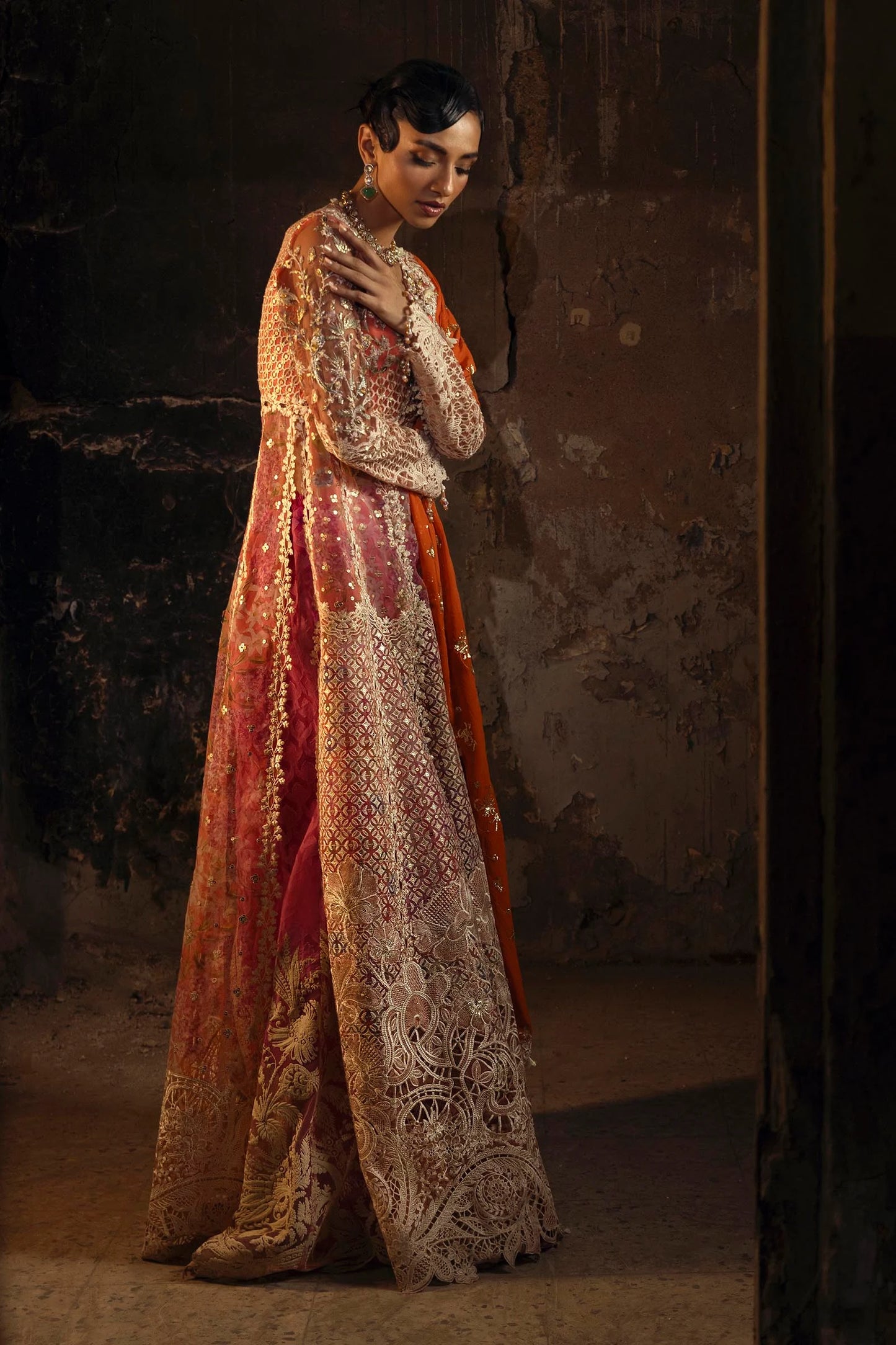 Model wearing deep coral and gold Sana Safinaz N251-002-3CX outfit with intricate embroidery and orange dupatta, Pakistani Luxury pret, Pakistani clothes online in UK.
