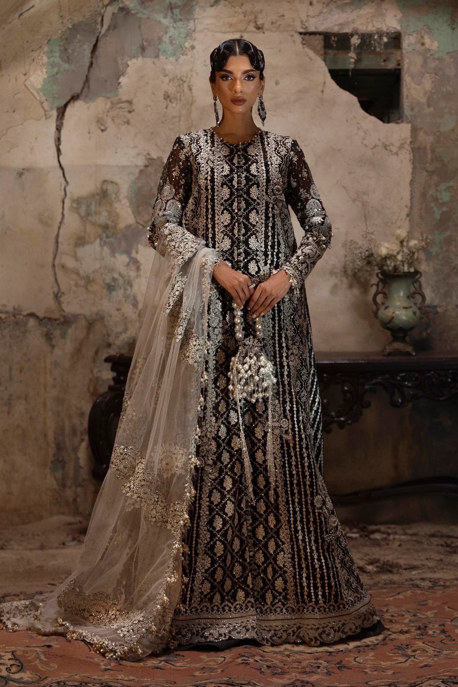 Model wearing black and silver Sana Safinaz N251-003-3CX outfit with intricate embroidery and ivory net dupatta, Pakistani Luxury pret, Pakistani clothes online in UK.