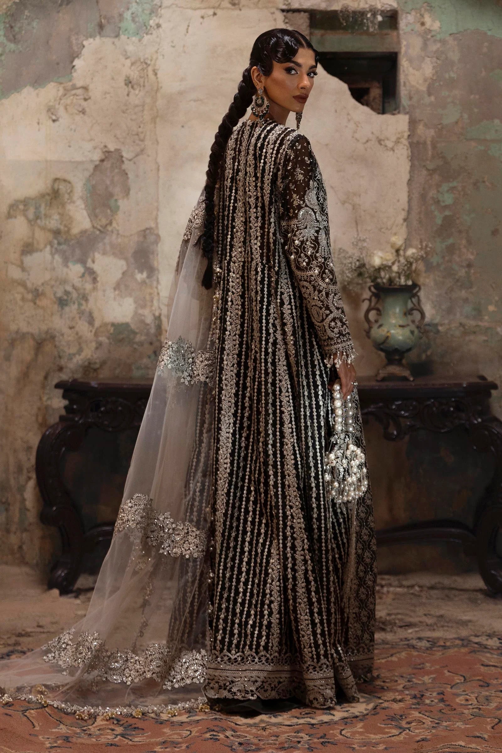 Model wearing black and silver Sana Safinaz N251-003-3CX outfit with intricate embroidery and ivory net dupatta, Pakistani Luxury pret, Pakistani clothes online in UK.