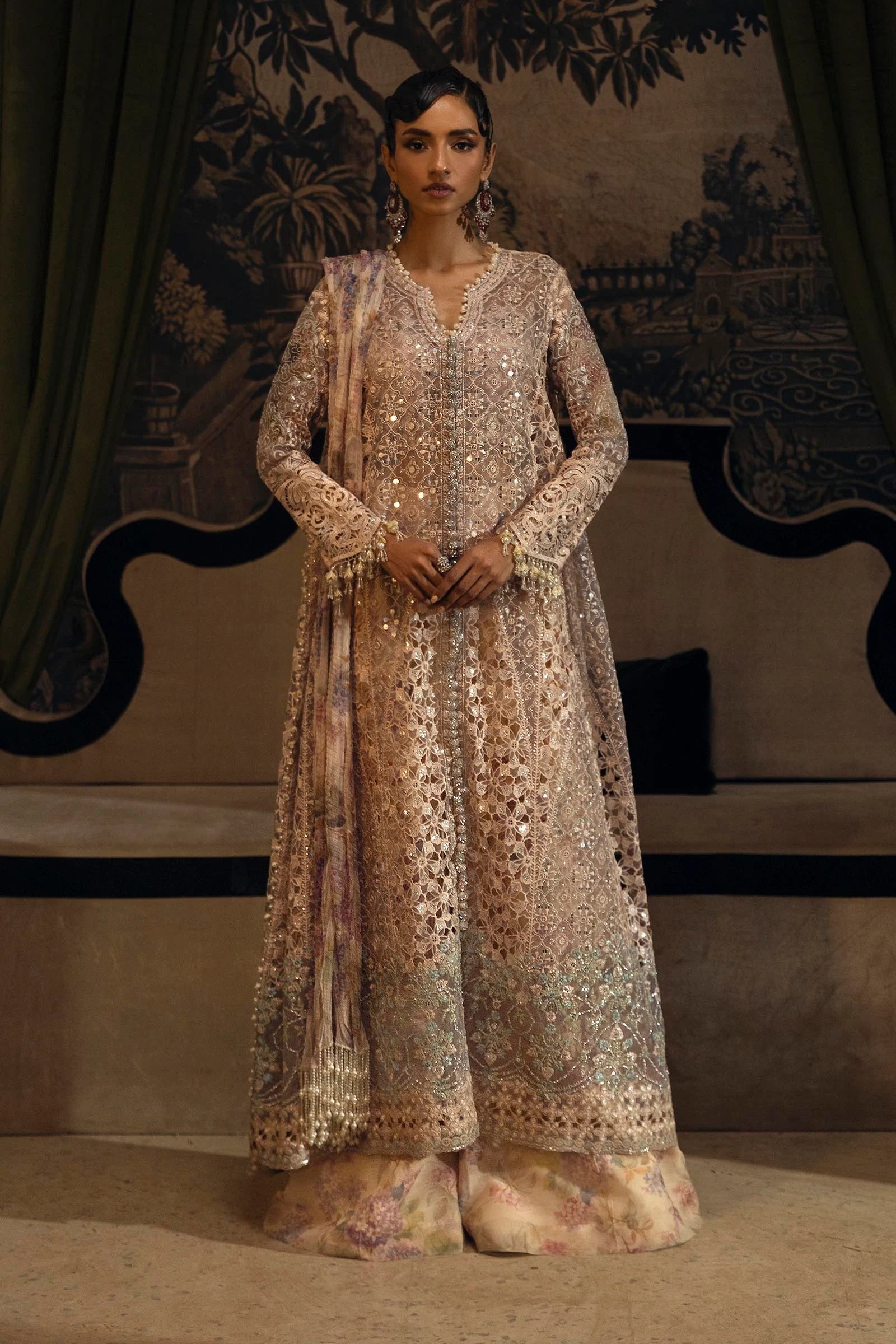 Model wearing pastel beige Sana Safinaz N251-004-3DJ outfit with mirror work and floral printed lehenga, Pakistani Luxury pret, Pakistani clothes online in UK.