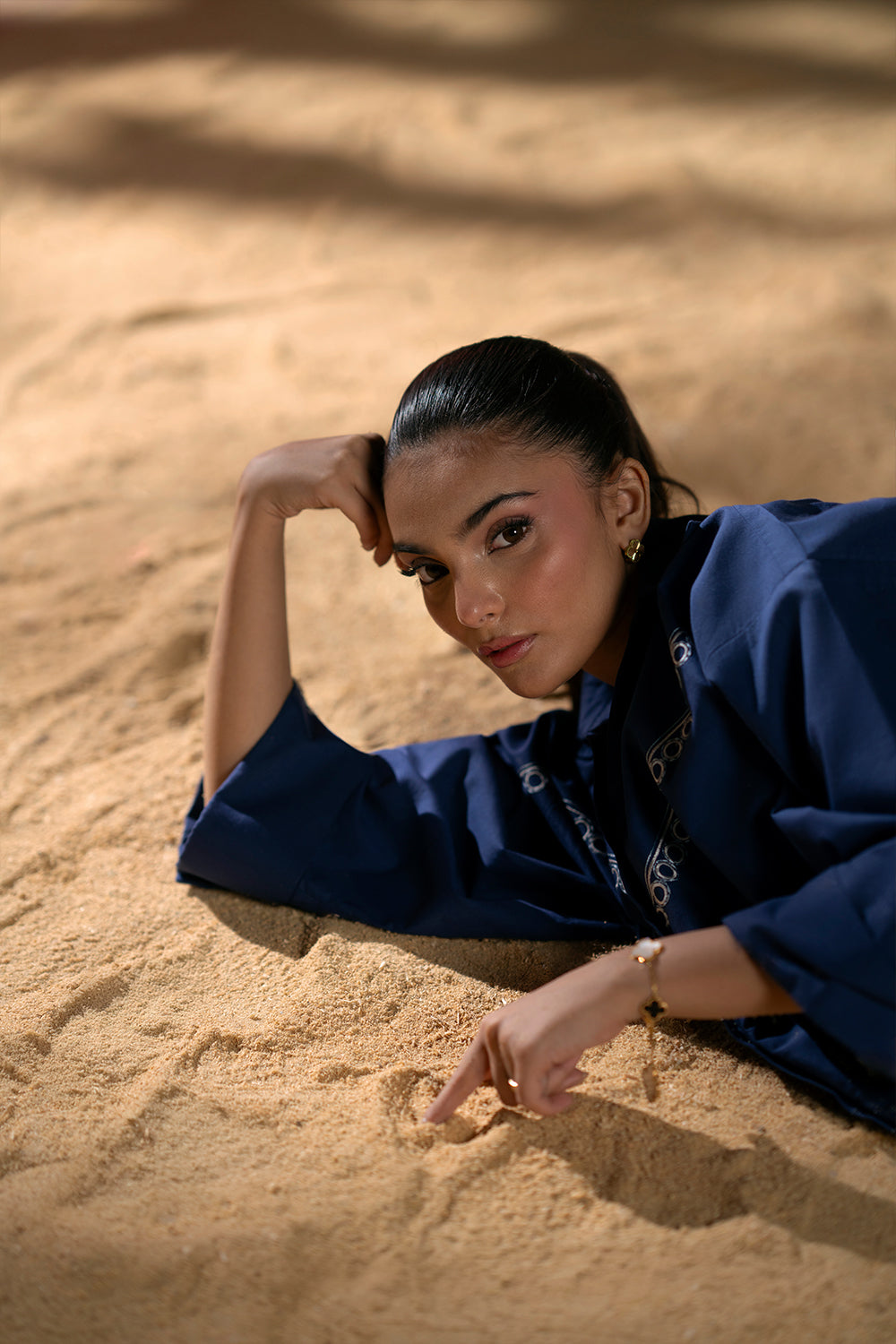 Model wearing navy blue embroidered outfit from Saira Rizwan Joolie | BLUE-JBP25-03, Pakistani luxury pret available online in UK.