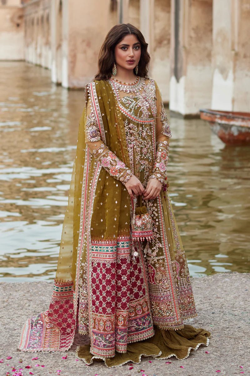 Model wearing Qalamkaar Shadmani Luxury Formals '24 Rameesha SH - 01 dress in olive green and deep red with intricate embroidery. Shop Pakistani bridal dresses online in the UK now.