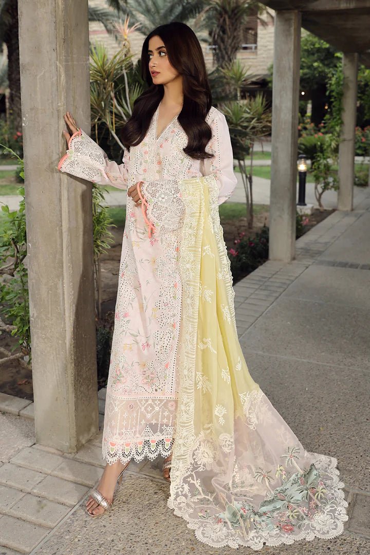 Model flaunting stunning IRSA dress by Qalamkar, ideal for Eid festivities. Discover Pakistani lawn dresses in the UK!