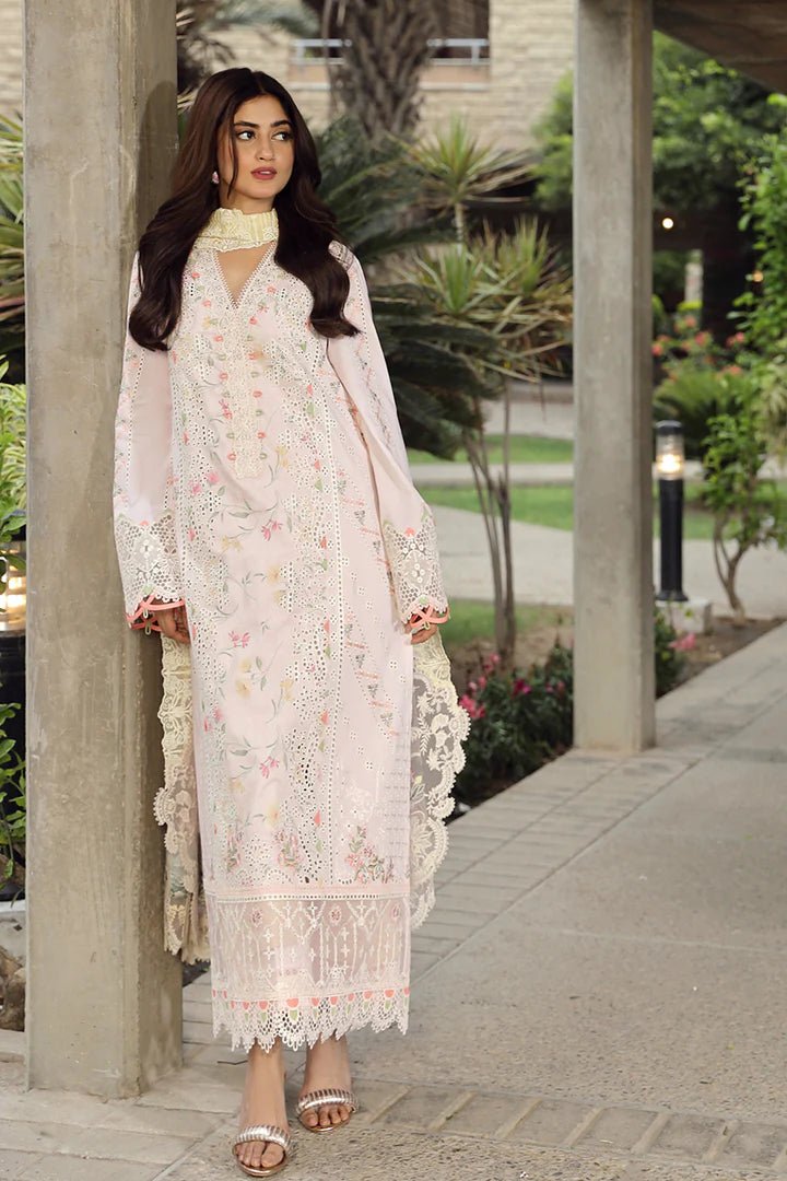 Model flaunting stunning IRSA dress by Qalamkar, ideal for Eid festivities. Discover Pakistani lawn dresses in the UK!