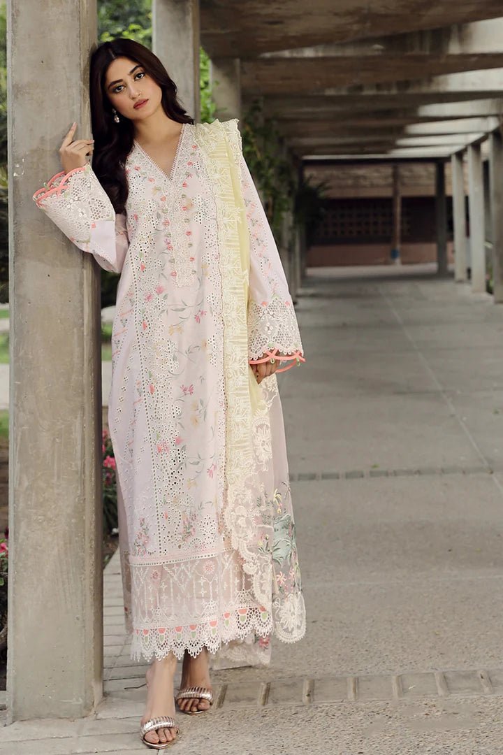 Model flaunting stunning IRSA dress by Qalamkar, ideal for Eid festivities. Discover Pakistani lawn dresses in the UK!