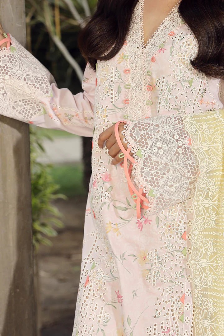 Model flaunting stunning IRSA dress by Qalamkar, ideal for Eid festivities. Discover Pakistani lawn dresses in the UK!