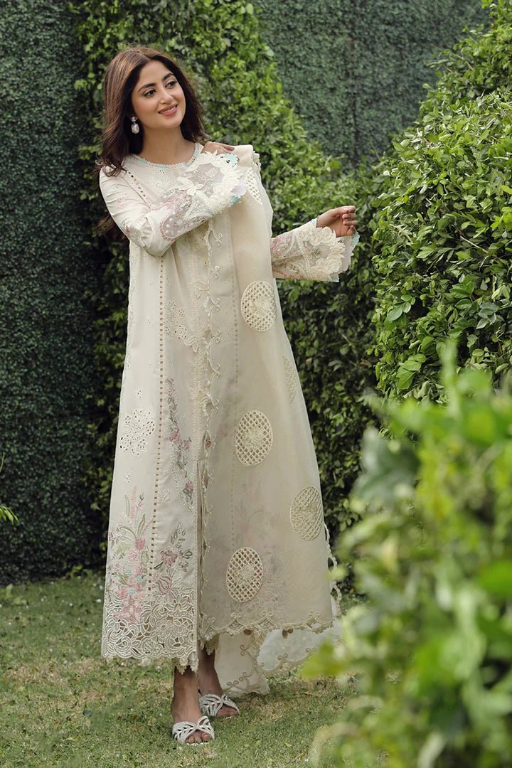 Model showcasing exquisite ZUHA dress by Qalamkar, perfect for Eid festivities. Discover Pakistani lawn dresses in the UK!