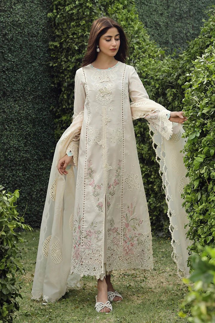 Model showcasing exquisite ZUHA dress by Qalamkar, perfect for Eid festivities. Discover Pakistani lawn dresses in the UK!