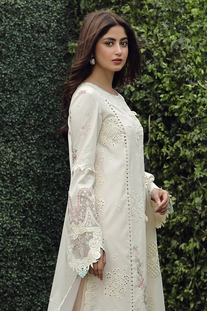 Model showcasing exquisite ZUHA dress by Qalamkar, perfect for Eid festivities. Discover Pakistani lawn dresses in the UK!