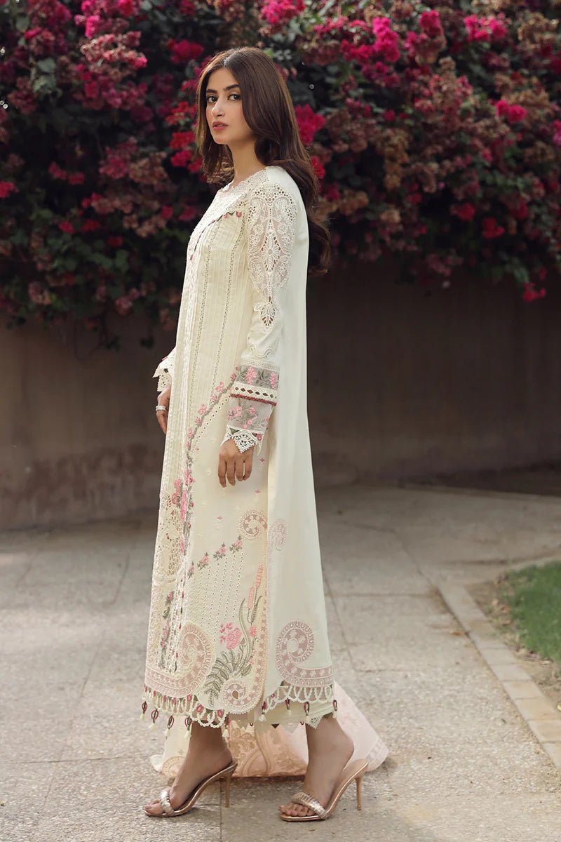 Model showcasing exquisite AMAAR dress by Qalamkar, perfect for Eid celebrations. Shop Pakistani lawn dresses in the UK!