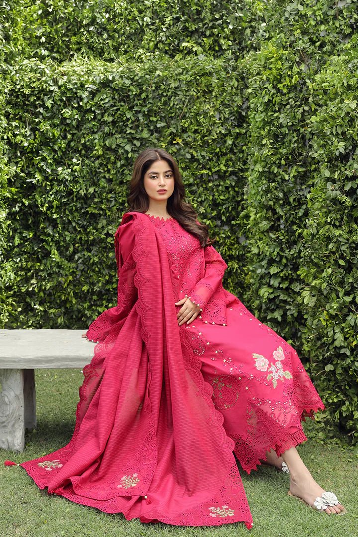 Model wearing Qalamkar Maliha dress in deep pink, showcasing intricate embroidery and lace details, ideal for Pakistani lawn dresses and Eid clothes for women in the UK.