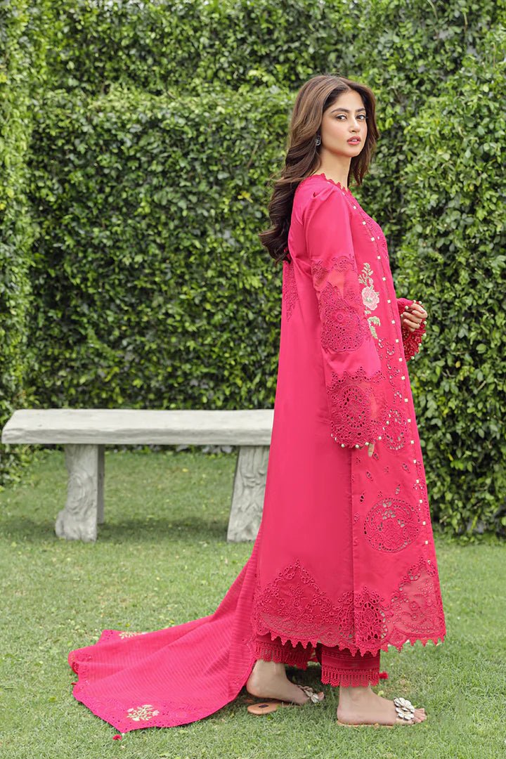 Model wearing Qalamkar Maliha dress in deep pink, showcasing intricate embroidery and lace details, ideal for Pakistani lawn dresses and Eid clothes for women in the UK.