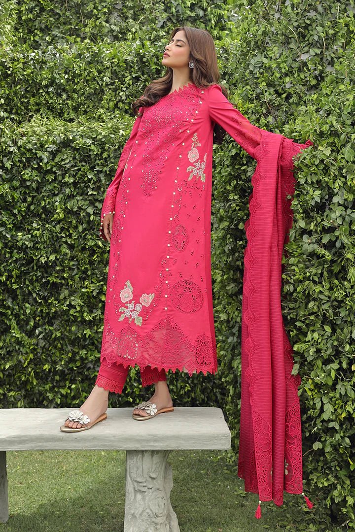 Model wearing Qalamkar Maliha dress in deep pink, showcasing intricate embroidery and lace details, ideal for Pakistani lawn dresses and Eid clothes for women in the UK.