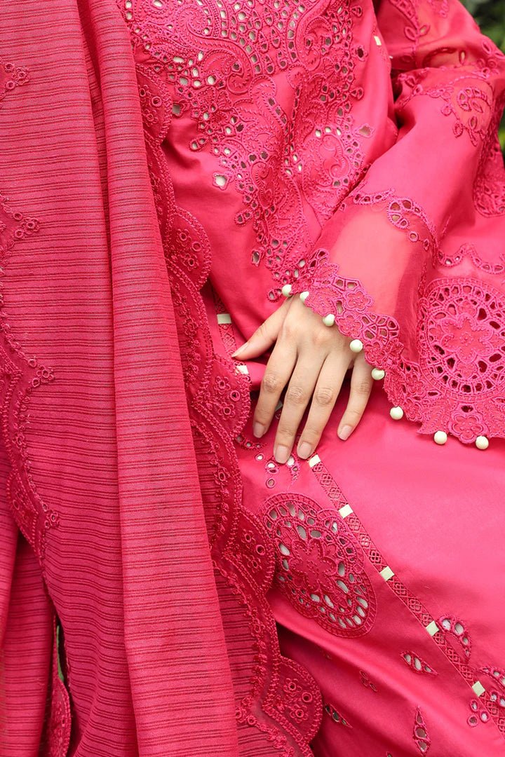 Model wearing Qalamkar Maliha dress in deep pink, showcasing intricate embroidery and lace details, ideal for Pakistani lawn dresses and Eid clothes for women in the UK.