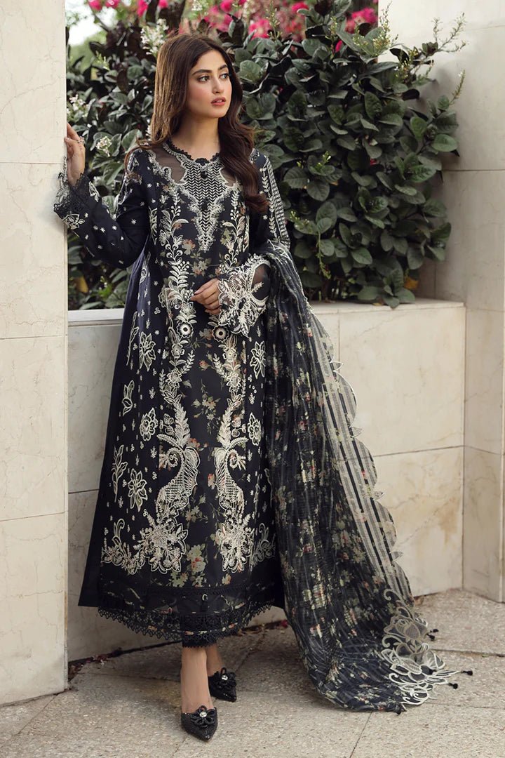 Model in exquisite black HAMNA dress by Qalamkar, perfect for Eid celebrations. Shop Pakistani lawn dresses in the UK!