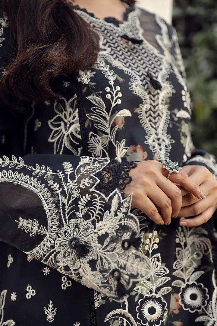 Model in exquisite black HAMNA dress by Qalamkar, perfect for Eid celebrations. Shop Pakistani lawn dresses in the UK!