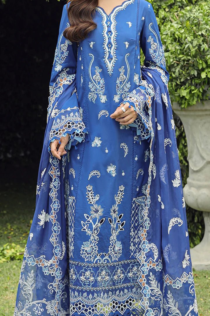 Model showcasing stunning BLUE FARHEEN dress by Qalamkar, perfect for Eid celebrations. Explore Pakistani lawn dresses in the UK!