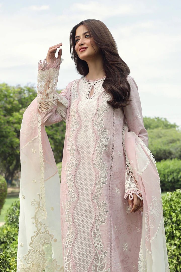 Model wearing Qalamkar Farva dress in soft pink with white embroidery, featuring elegant lace and detailed accents, perfect for Pakistani lawn dresses and Eid clothes in the UK.