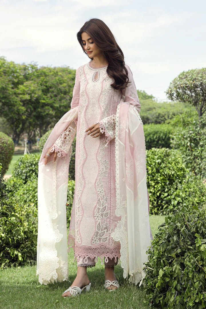 Model wearing Qalamkar Farva dress in soft pink with white embroidery, featuring elegant lace and detailed accents, perfect for Pakistani lawn dresses and Eid clothes in the UK.