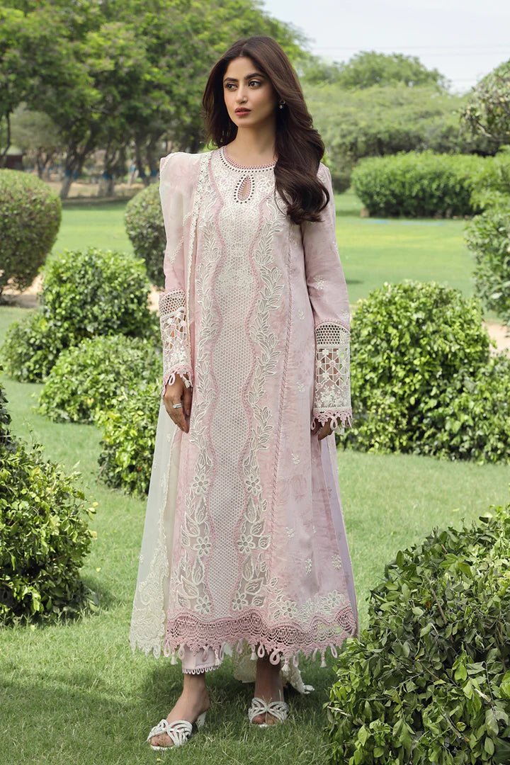 Model wearing Qalamkar Farva dress in soft pink with white embroidery, featuring elegant lace and detailed accents, perfect for Pakistani lawn dresses and Eid clothes in the UK.