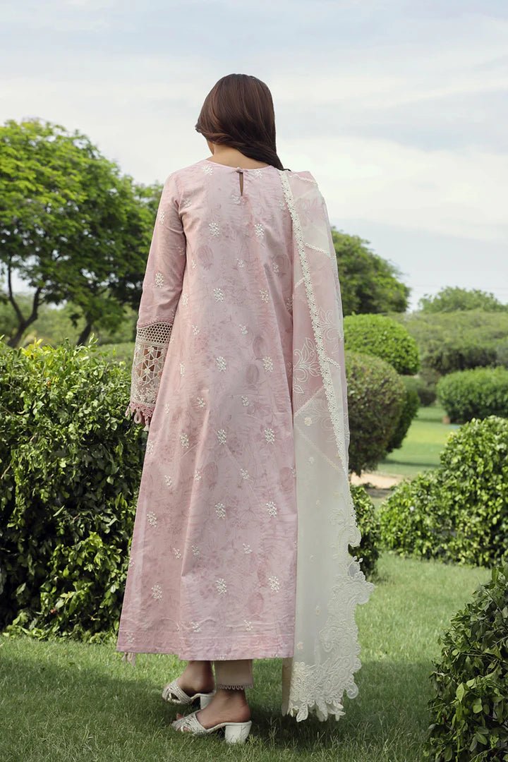 Model wearing Qalamkar Farva dress in soft pink with white embroidery, featuring elegant lace and detailed accents, perfect for Pakistani lawn dresses and Eid clothes in the UK.