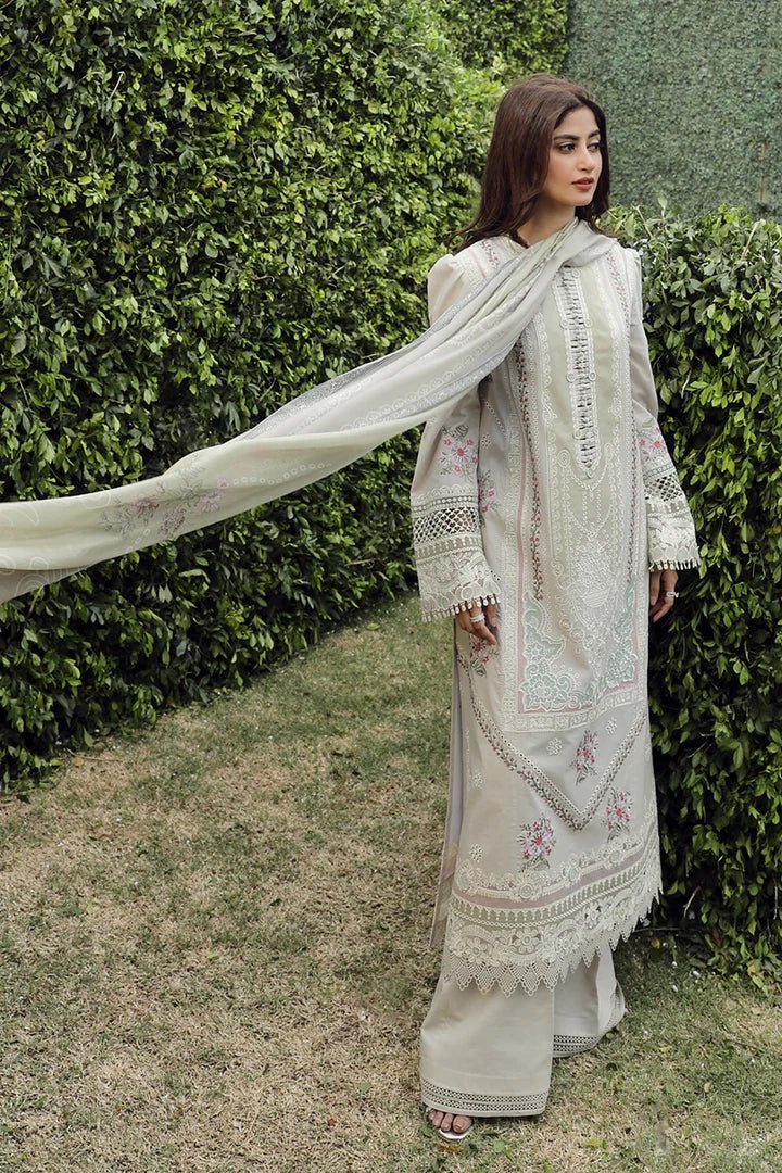 Model wearing Qalamkar PS - 11 Rinnah dress in bright pink, featuring intricate white embroidery, ideal for Pakistani lawn dresses and Eid clothes in the UK.