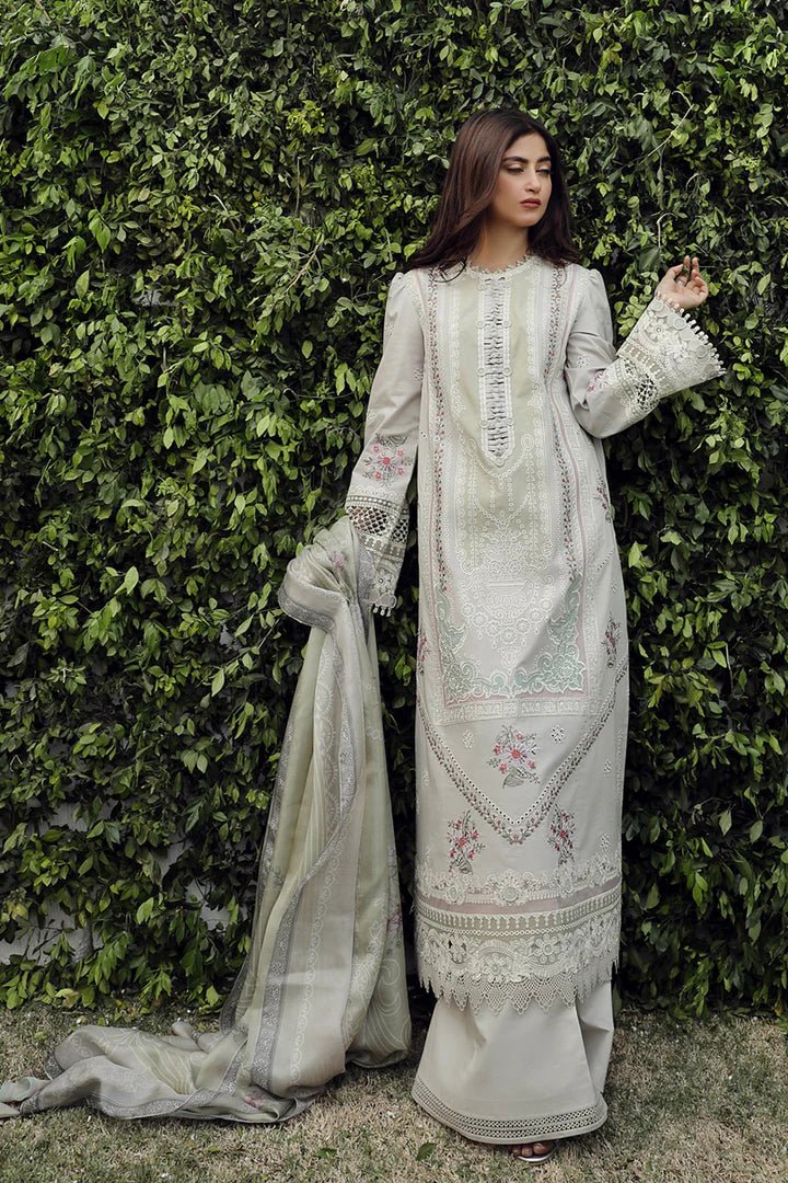 Model wearing Qalamkar PS - 11 Rinnah dress in bright pink, featuring intricate white embroidery, ideal for Pakistani lawn dresses and Eid clothes in the UK.