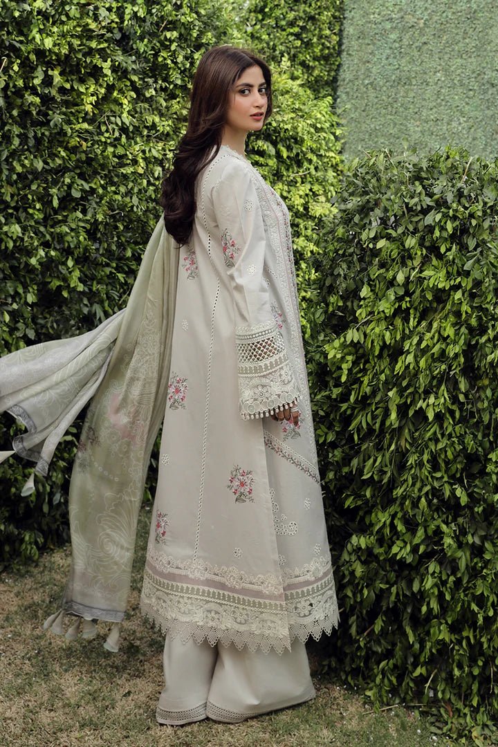 Model wearing Qalamkar PS - 11 Rinnah dress in bright pink, featuring intricate white embroidery, ideal for Pakistani lawn dresses and Eid clothes in the UK.