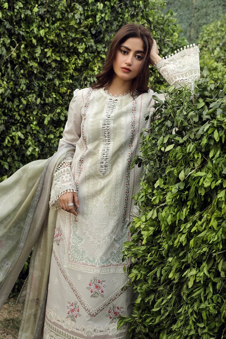 Model wearing Qalamkar PS - 11 Rinnah dress in bright pink, featuring intricate white embroidery, ideal for Pakistani lawn dresses and Eid clothes in the UK.