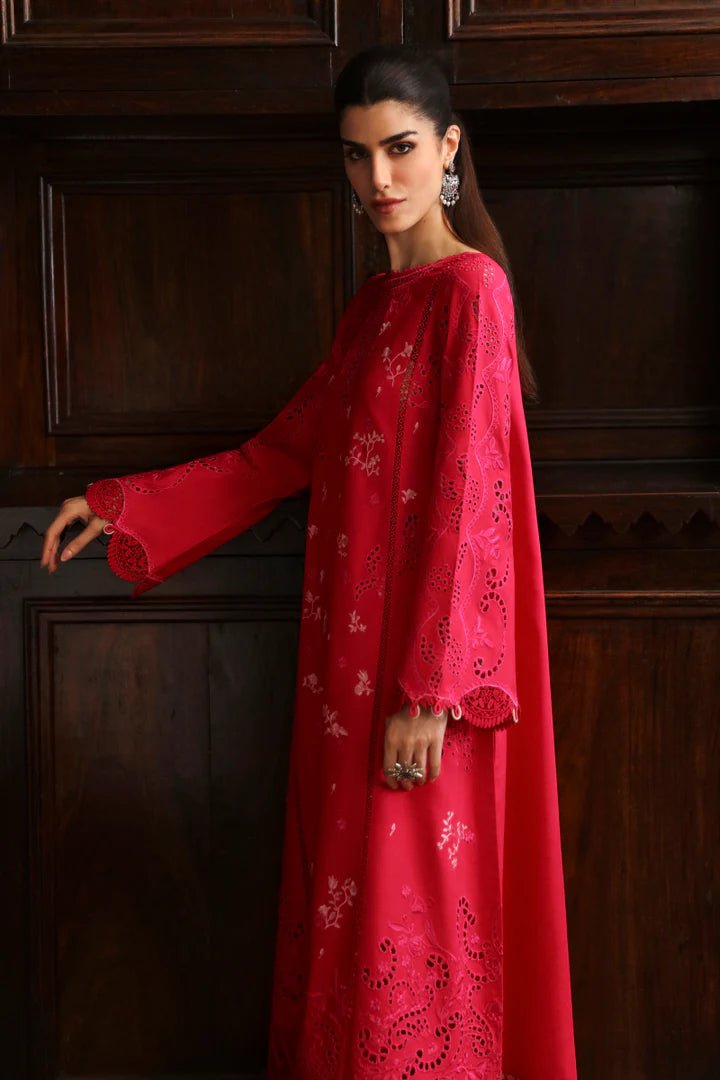 Model wearing LM - 07 NEESA dress from Qalamkar's Qlinekari Linen collection in vibrant red. Pakistani winter casual pret available online in the UK.