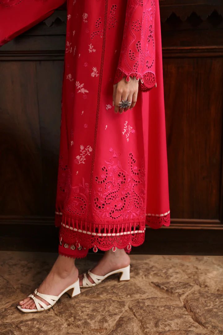 Model wearing LM - 07 NEESA dress from Qalamkar's Qlinekari Linen collection in vibrant red. Pakistani winter casual pret available online in the UK.