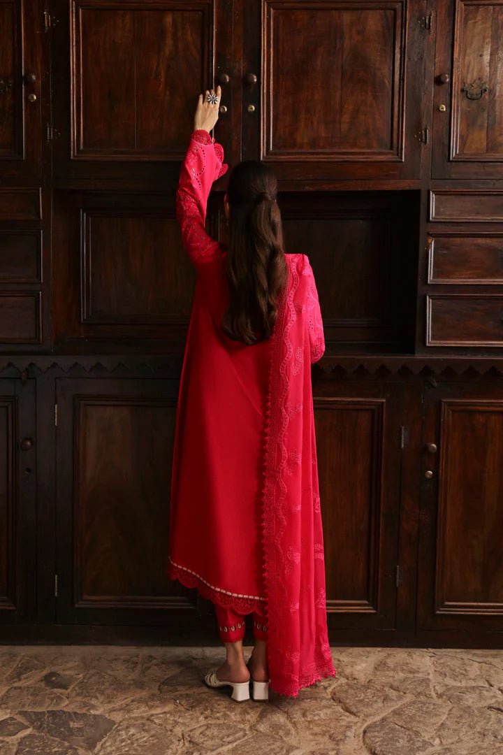 Model wearing LM - 07 NEESA dress from Qalamkar's Qlinekari Linen collection in vibrant red. Pakistani winter casual pret available online in the UK.