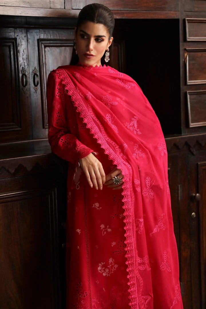 Model wearing LM - 07 NEESA dress from Qalamkar's Qlinekari Linen collection in vibrant red. Pakistani winter casual pret available online in the UK.